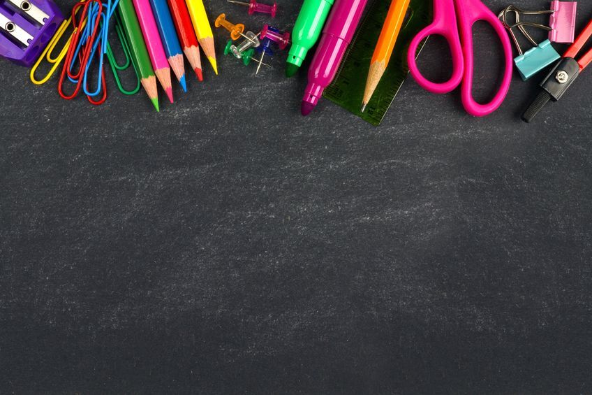 School supplies top border on a chalkboard background